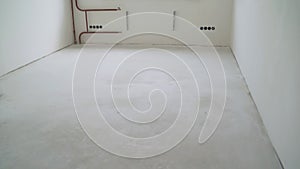 Floor leveling works. Fresh concrete floor of a construction site