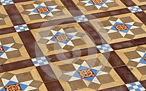 A floor with medieval worn tiles