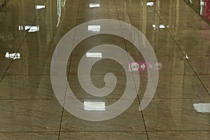 The floor on one of the floors of the modern store is paved with shiny tiles photo