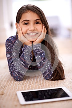 Floor, portrait or kid with tablet for streaming, playing games or watching fun videos on movie website. Girl, house or