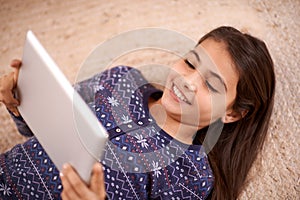 Floor, smile or child with tablet for streaming, playing games or watching fun videos on movie website. Above, house or