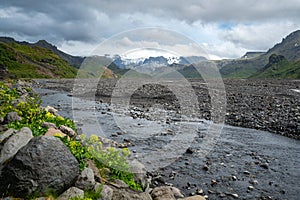 Floor of Thorsmork valley in Southern Iceland on a cloudy spring day. Cold sky above the famous Laugavegur trail. River