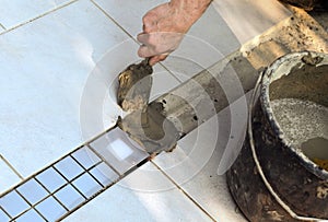 Floor tiler filling cement