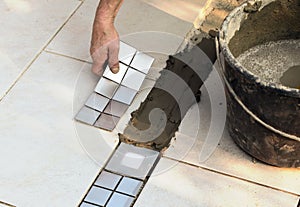 Floor tiler at work