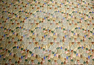 Floor tiles in coloured patterns