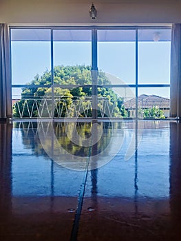 Floor-to-ceiling glass windows door in the living room.Vertical photo image.