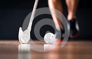 Floorball or floor hockey concept. Player running with ball and stick. photo