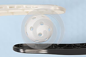 Floorball stick and white ball