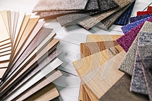 Flooring and furniture materials - floor carpet and wooden laminate samples