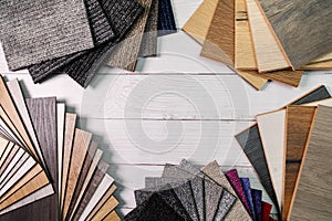 Flooring and furniture materials - floor carpet and wooden laminate samples with copy space