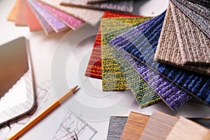 Flooring and furniture materials - floor carpet and wooden laminate samples for interior design project