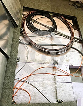Electrical cables under the subflooring