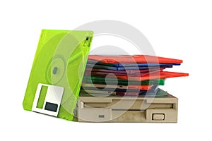 Floppy disk drive and diskettes on white background