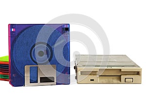 Floppy disk drive and diskettes on white background