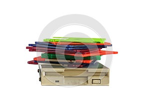 Floppy disk drive and diskettes on white background