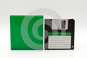 Floppy disk of 1.4 megabytes isolated on white background and plastic protective box photo