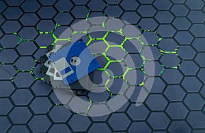 A floppy disk from an old computer placed on a black mouse pad