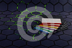 A floppy disk from an old computer placed on a black mouse pad