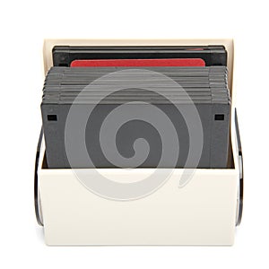 Floppy disk organizer case filled with diskettes, isolated photo