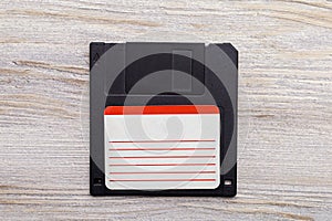 Floppy disk on the table. Nostalgia concept. A rudiment or object that has gone down in history. Background