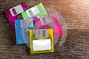 Floppy disks on a wooden table background