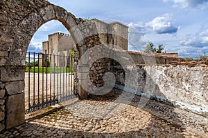 Flor da Rosa Monastery in Crato seen through the gothic gate. photo