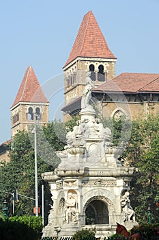 Flora fountain in front of colonial building, India