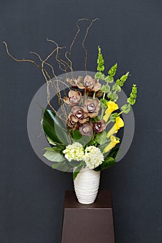 Floral arangement with Calla, cymbidium, Hydrangea, Orchids moluccella