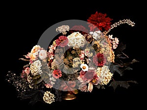 Floral arrangement, autumn bouquet, on black background. Toned i