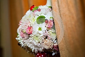 Floral arrangement on a baptismal candle