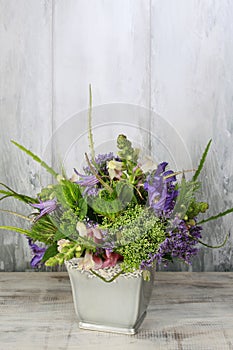 Floral arrangement with delphinium and matthiola flowers