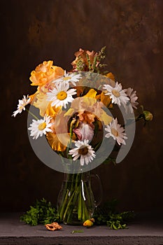 Floral arrangement with irises and daisies