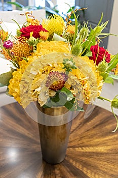 Floral arrangement of roses and carnations