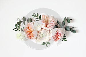 Floral arrangement, web banner with pink English roses, ranunculus, carnation flowers and green leaves on white table