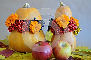 Floral arrangements and decoration. Pumpkin apples. Autumn bright flower arrangement in a pumpkin.