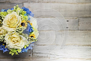 Floral Arrangment on Distressed Wood Surface Left Side