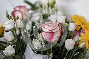 floral bouquet with pink and white roses and daises close-up photo