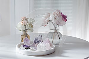 Floral bouquets with amethyst and quartz. A still life composition on marble