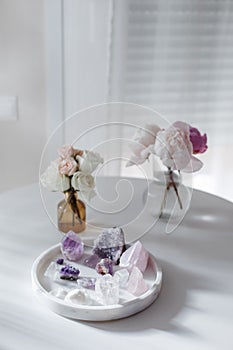 Floral bouquets with amethyst and quartz. A still life composition on marble