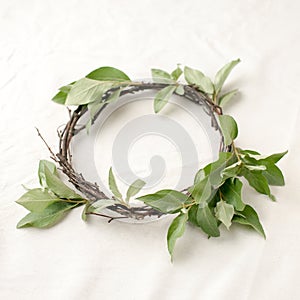 Floral composition. Wreath made of roools, leaves, and flowers on tissue white background. Rustic style of home decor, flat lay, t