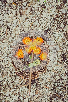 Floral decoration on grave during All Saints Day in the cemetery