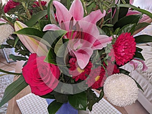 Floral display including Flashpoint pink and white Oriental Trumpet Lily closeup