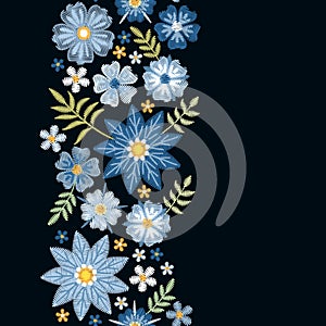 Floral embroidery. Vertical seamless line with beautiful blue flowers on black background.