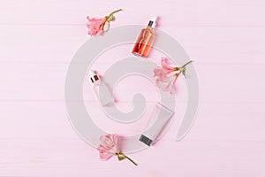 Floral flat lay composition cosmetic products for skin care cream moisturizer