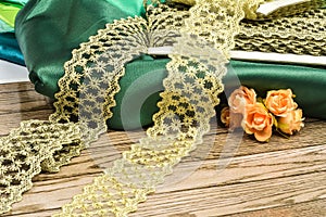 Golden rills background on green silk photo