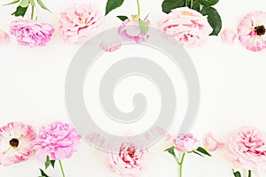 Floral frame of pastel pink roses and peonies on white background. Flat lay, top view. Spring time composition