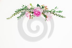 Floral frame of pink peony and roses flowers and eucalyptus on white background. Flat lay, top view