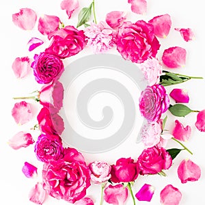 Floral frame with pink rose flowers and petals on white background. Flat lay, Top view. Flowers texture.