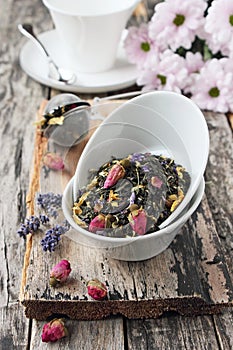 Floral herbal tea on a wooden table.