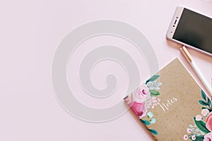 Floral journal/notepad on a pink background